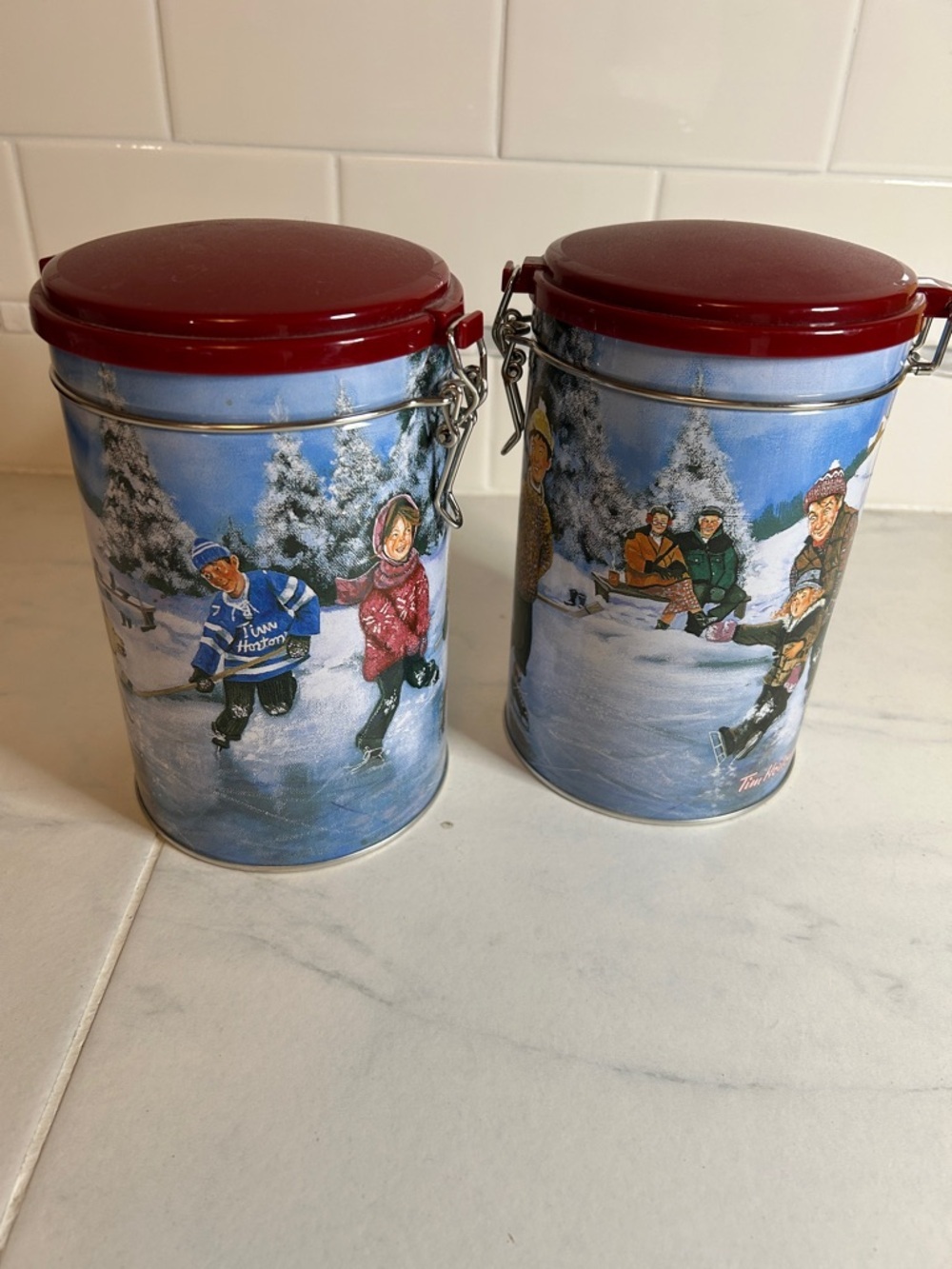 Tim Hortons 2 Winter skating Scene coffee tin with red lid. EUC!